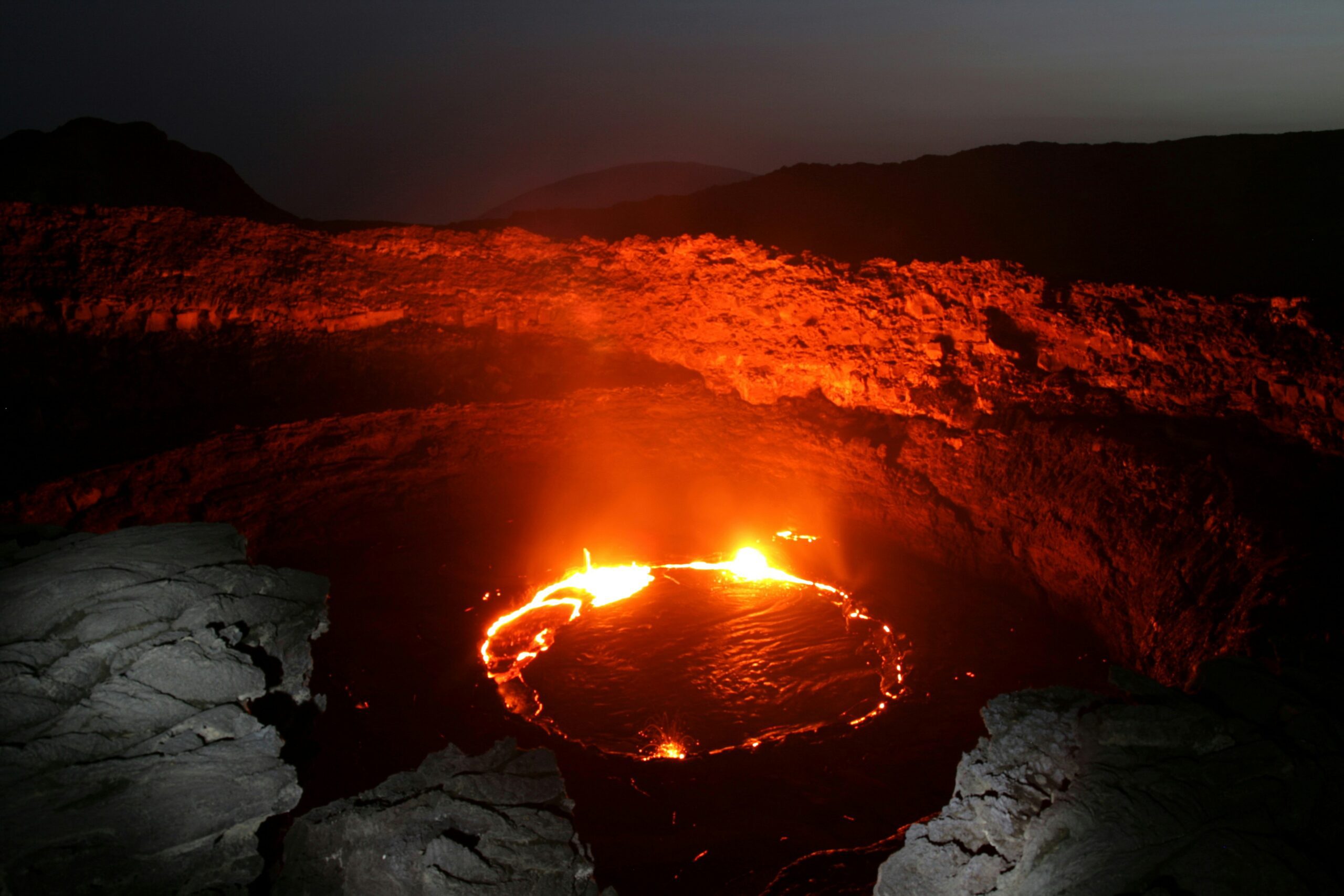 Ethiopian volcanic tour featuring Erta Ale lava lake, Danakil Depression, Dallol hydrothermal springs, Afar tribal villages, volcanic landscapes, and adventurous trekking