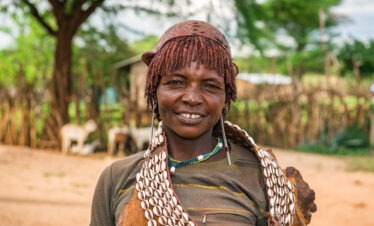 Mursi tribe woman with traditional lip plate in the Omo Valley, Ethiopia, cultural highlight of the Danakil Depression and Omo Valley 10 days tour